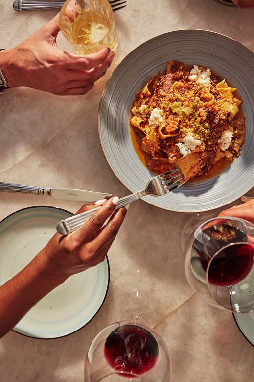 A couple shares dinner at parc in detroit.